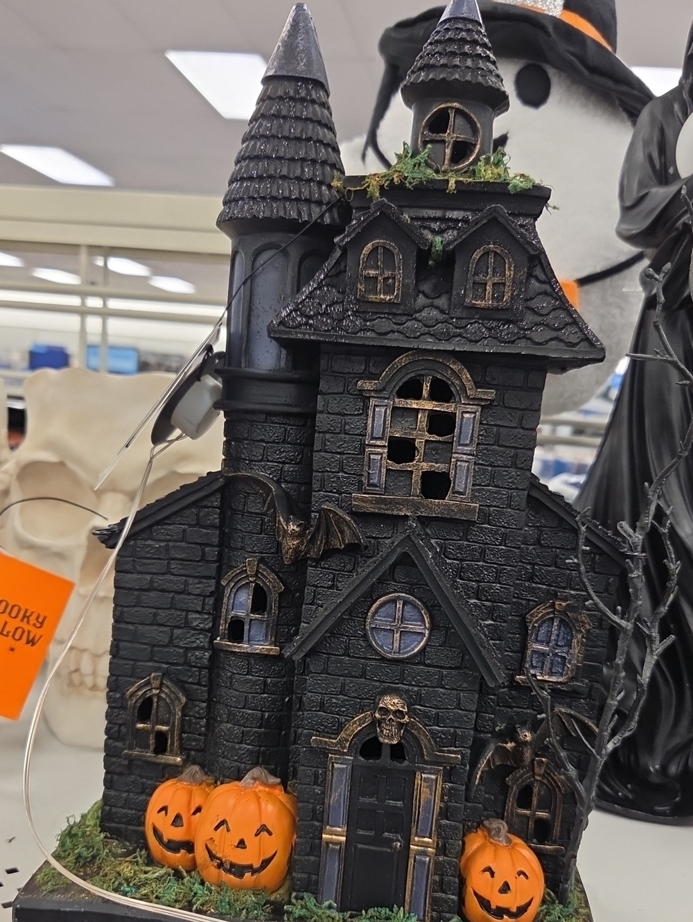 Haunted Black Halloween Castle with Orange Pumpkin Accents
